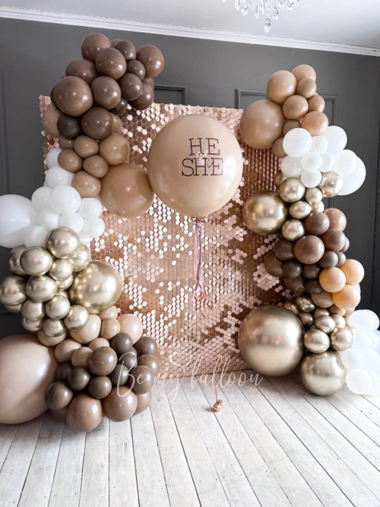 Balloon decoration for Gender party with shimmer backdrop wall Desert