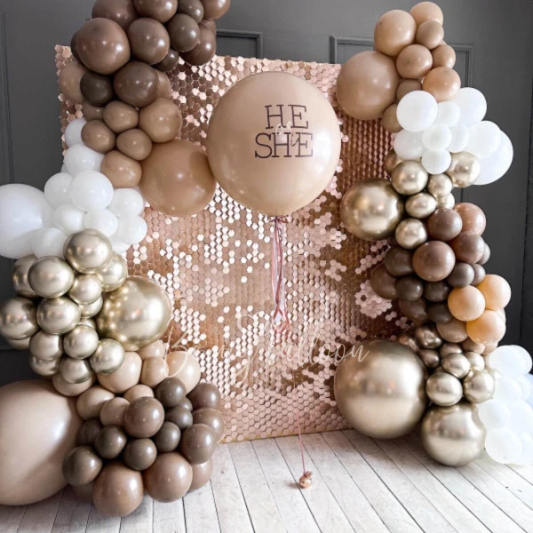 Balloon decoration for Gender party with shimmer backdrop wall Desert